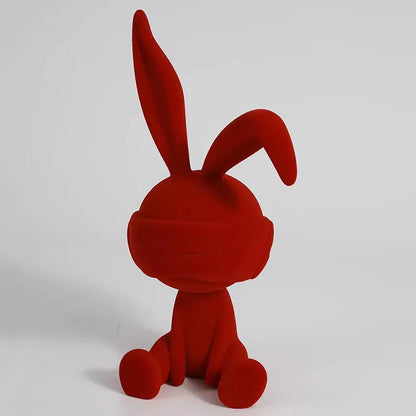 Green suede blindfold rabbit resin table ornament on a wooden shelf, showing detailed texture and 12cm height