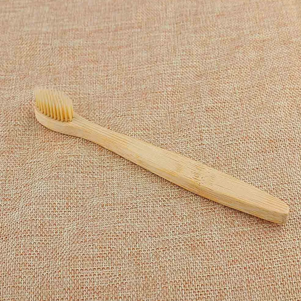 Organic bamboo toothbrush with 17.5cm ergonomic handle and charcoal-infused bristles for sustainable dental care