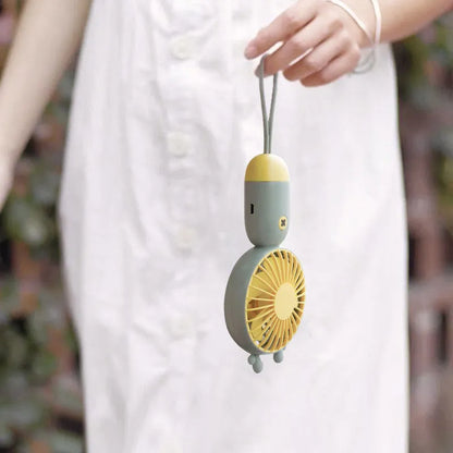 Handheld portable mini fan in green, pink, purple, or white, made from ABS and silicone with 500mAh battery