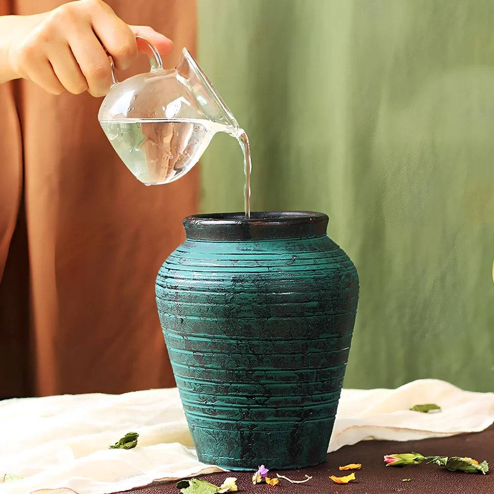 Ceramic mosaic vase with dried flowers, showing mosaic pattern and 25cm height