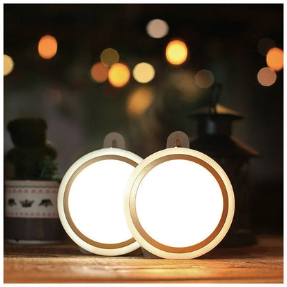 A round, white, battery-powered motion sensor LED light with a diameter of 80mm.