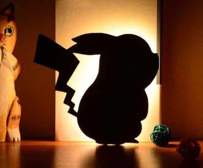 Assorted animal-shaped night lights with motion sensor, including a walking cat, mother and child cat, licking cat, looking back cat, and Pikachu