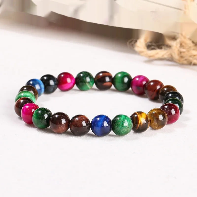 Colourful tiger eye gemstone bracelet with geometric round beads in assorted earthy tones.