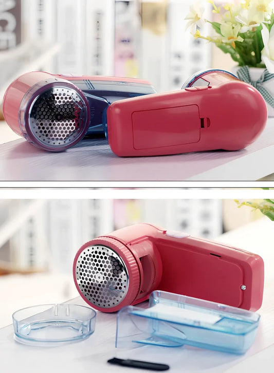 Portable electric lint remover device measuring 11x16x9.5cm with USB charging cable