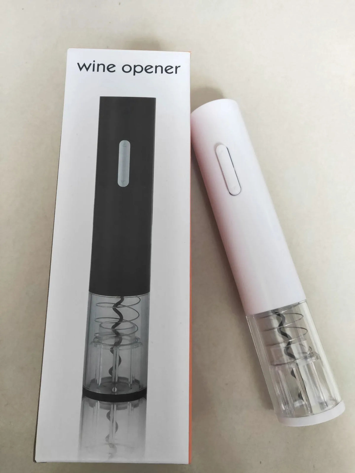 Automatic electric wine bottle opener with foil cutter in black, red, or white.