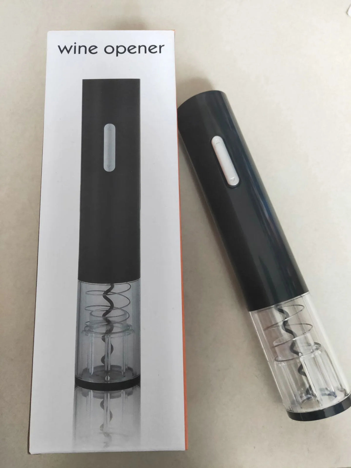 Automatic electric wine bottle opener with foil cutter in black, red, or white.