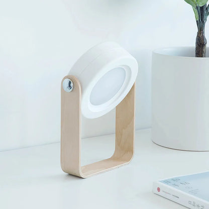 White foldable USB rechargeable LED night light in both table lamp and tall lantern modes.