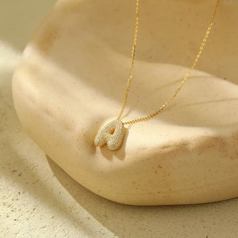 Stainless steel initial pendant necklace with zircon accents, personalized with your choice of letter.