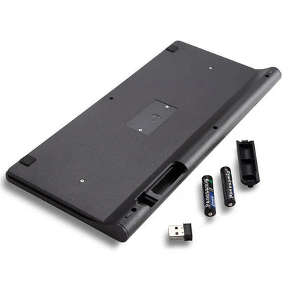 Black and white wireless keyboard and mouse set on a desk with 4G dongle