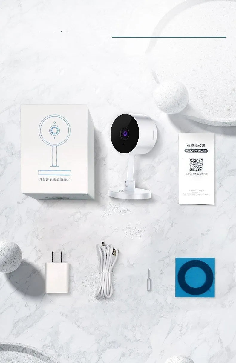 White gun-shaped Flash Fish WiFi home security camera on a table.