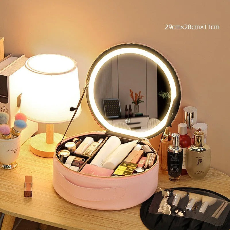 Round black LED light makeup bag with built-in mirror, carry strap, and open compartment showing internal partitions.