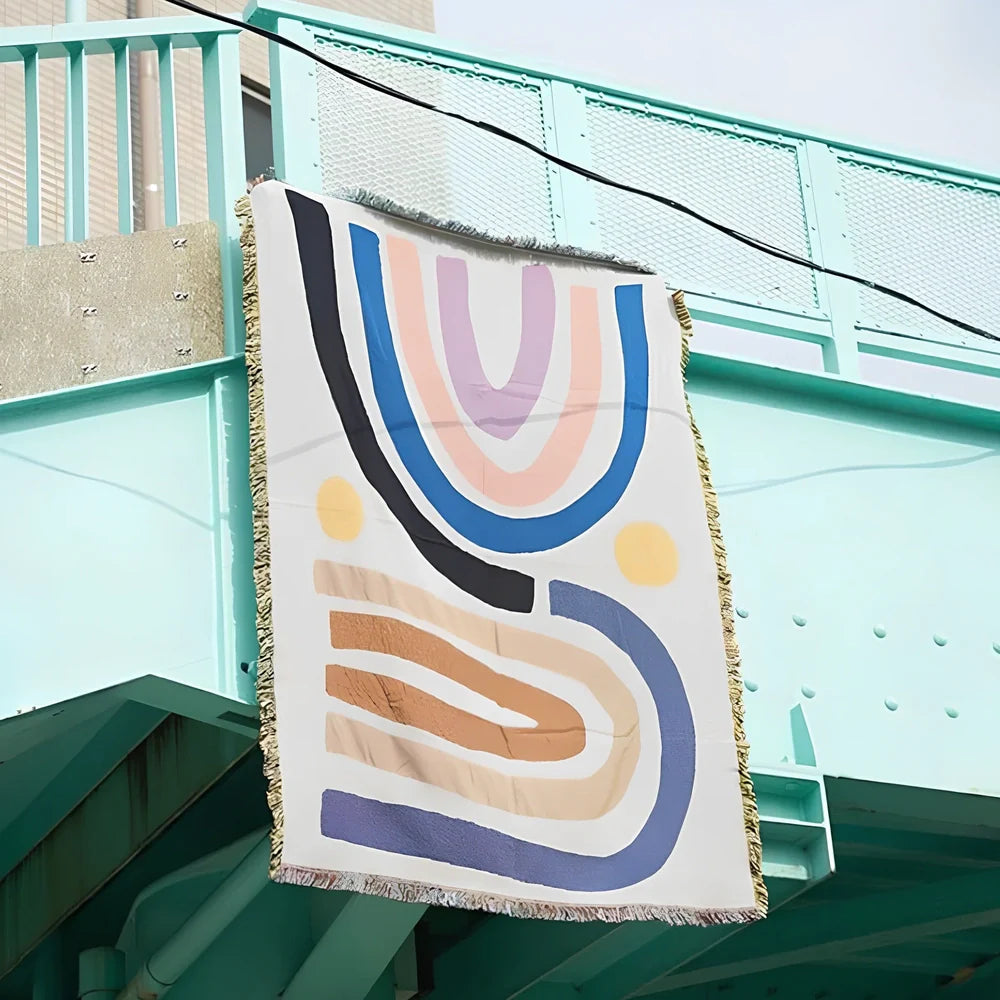 Bohemian rainbow geometric pattern tapestry blanket hanging on wall showing 120×150cm or 150×210cm dimensions