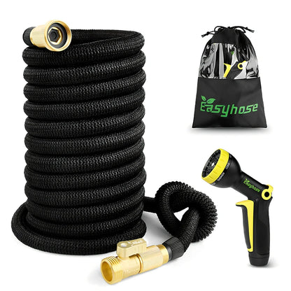 Expandable flexible water hose with spray gun showing green colour and extended length with water spraying in cone pattern