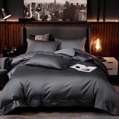 Four-piece quilted cotton bed set in royal blue, showing 200x230 cm cover and 48x74 cm pillowcases for 1.5m bed