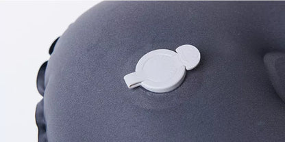 Compact inflatable travel pillow in peacock blue, bright orange, or green for camping and outdoor use