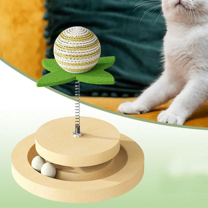 Green sisal scratching pad cat toy with rotating ball track and spring elements for indoor feline play