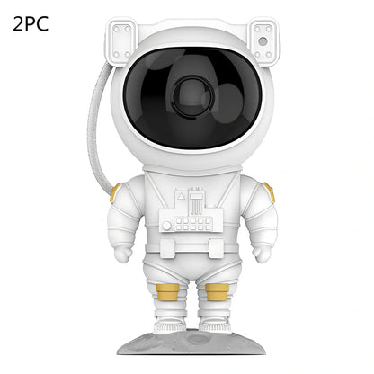 Astronaut-themed galaxy projector with adjustable nebula effects on table showing starry sky projection