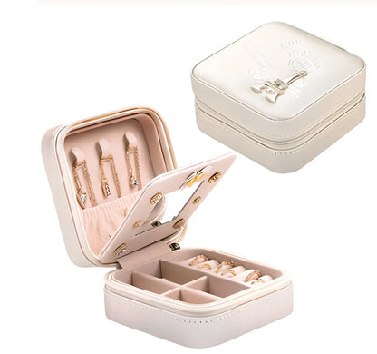 Three-layer travel jewellery box with PU leather exterior and secure closure for organised accessory storage
