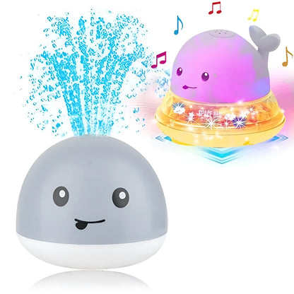 Automatic water-spraying whale bath toy with colourful lights floating in bath water.