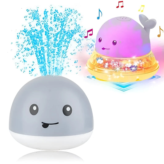 Automatic water-spraying whale bath toy with colourful lights floating in bath water.