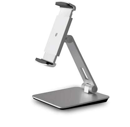 Silver foldable aluminium phone and tablet holder on a wooden desk, showing 360-degree rotation and silicone pads.