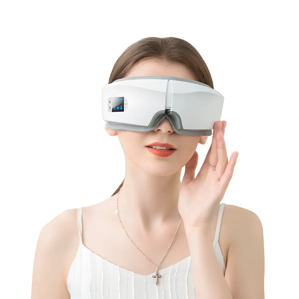 White folding eye massager device with LCD screen, shown in open and closed positions