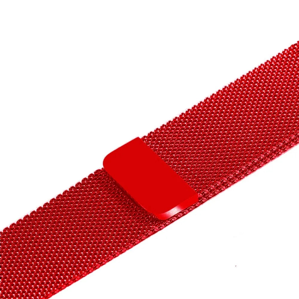 Stainless steel metal link strap for Apple Watch on a wrist, showing deployment clasp and polished finish