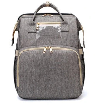 Versatile baby changing backpack with USB charging port and folding portable bed