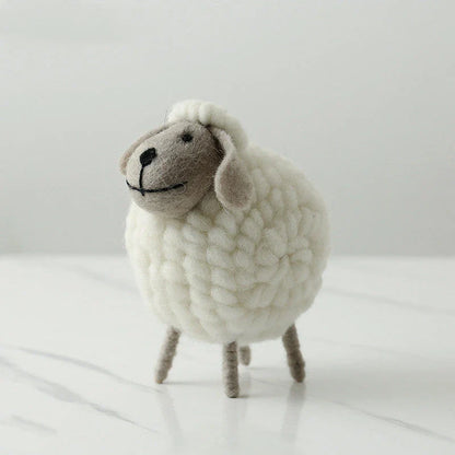 Adorable plush sheep decorations in various sizes and color combinations, perfect for adding a cozy, farmhouse-inspired touch to any home.