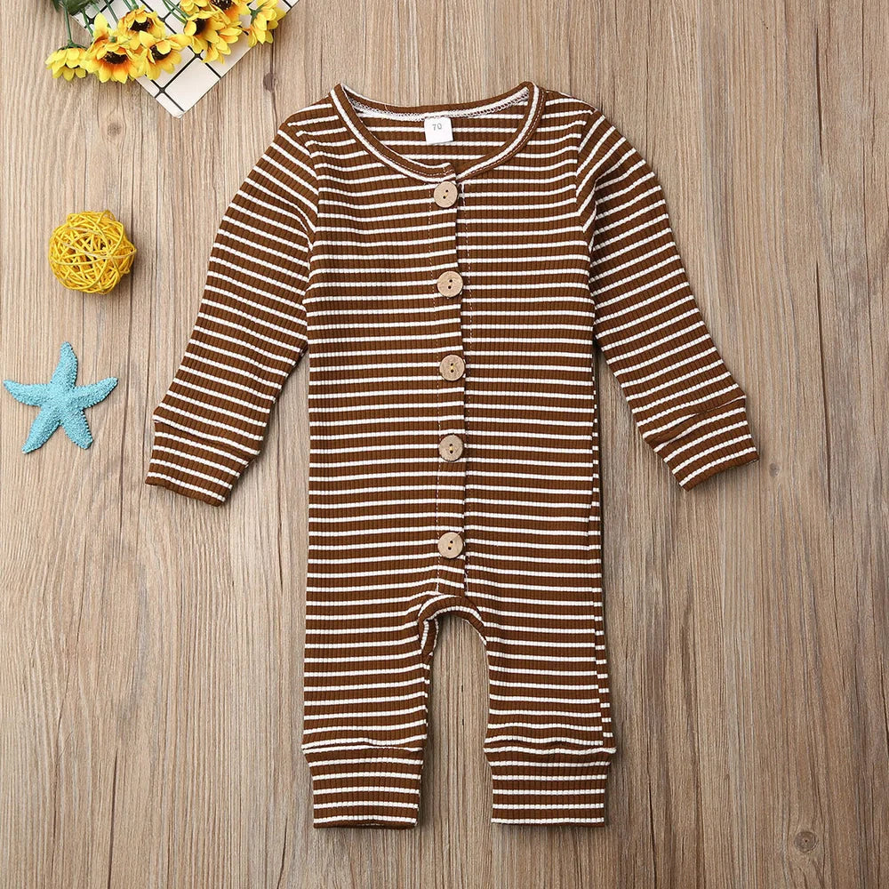 Newborn wearing a striped knitted jumpsuit in cotton, sizes 70-100cm, available in six colours