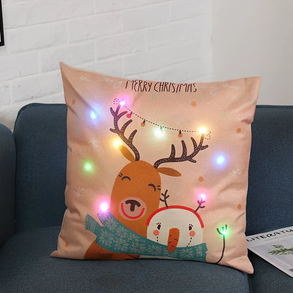 45cm square Christmas cushion with linen cover and battery-operated lighting showing festive design