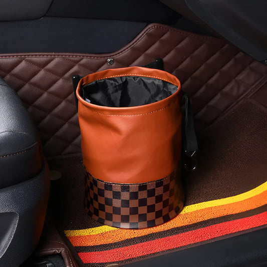 Black leather foldable car rubbish bin with a handle, shown empty.