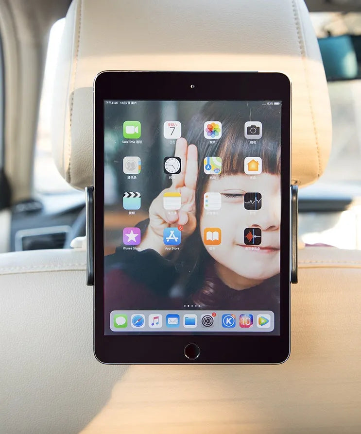 Black car tablet holder mounted on vehicle rear seat base holding iPad