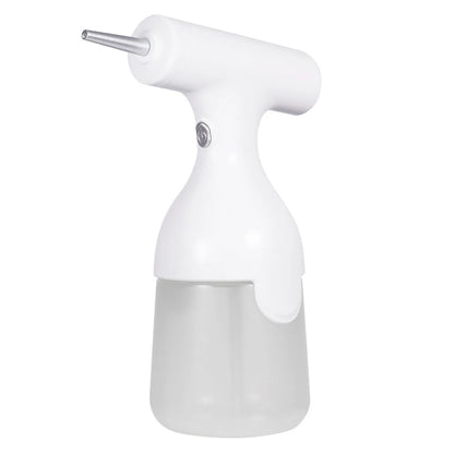 White electric automatic foam dispenser gun on a bathroom counter next to a sink
