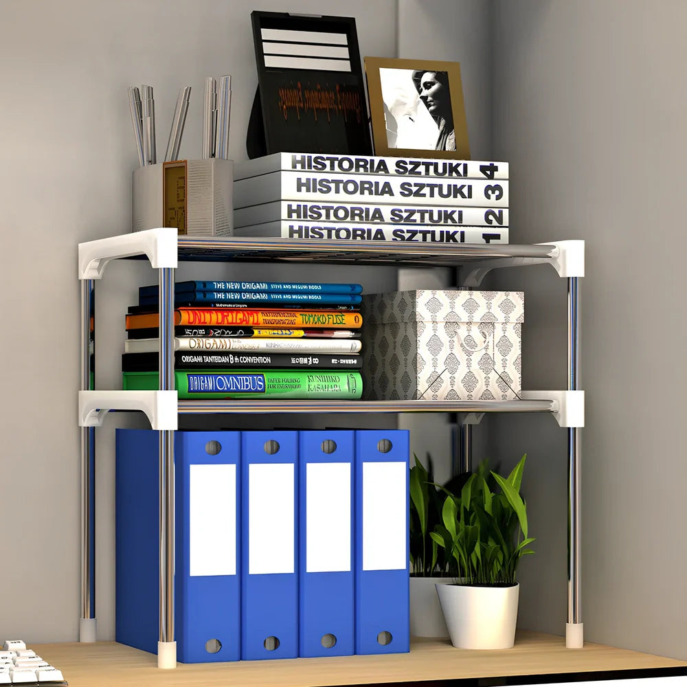 Silver and white microwave shelf rack with iron tubes and plastic connectors measuring 56.9cm wide