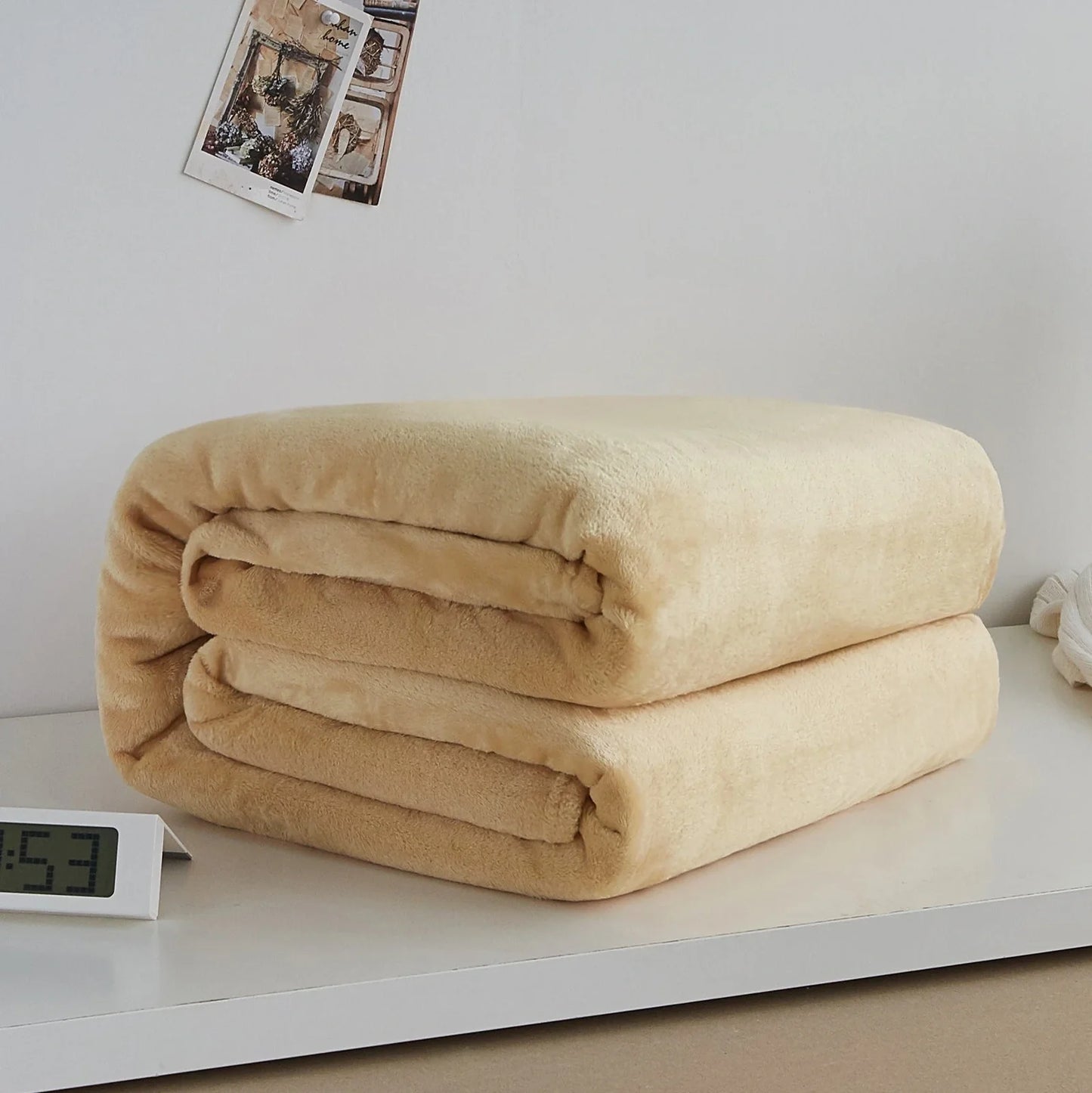 Coral fleece flannel blanket in beige showing textured surface and consistent edges