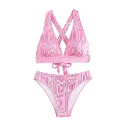 Pink women's halter neck bikini top and matching split-style shorts on a mannequin.