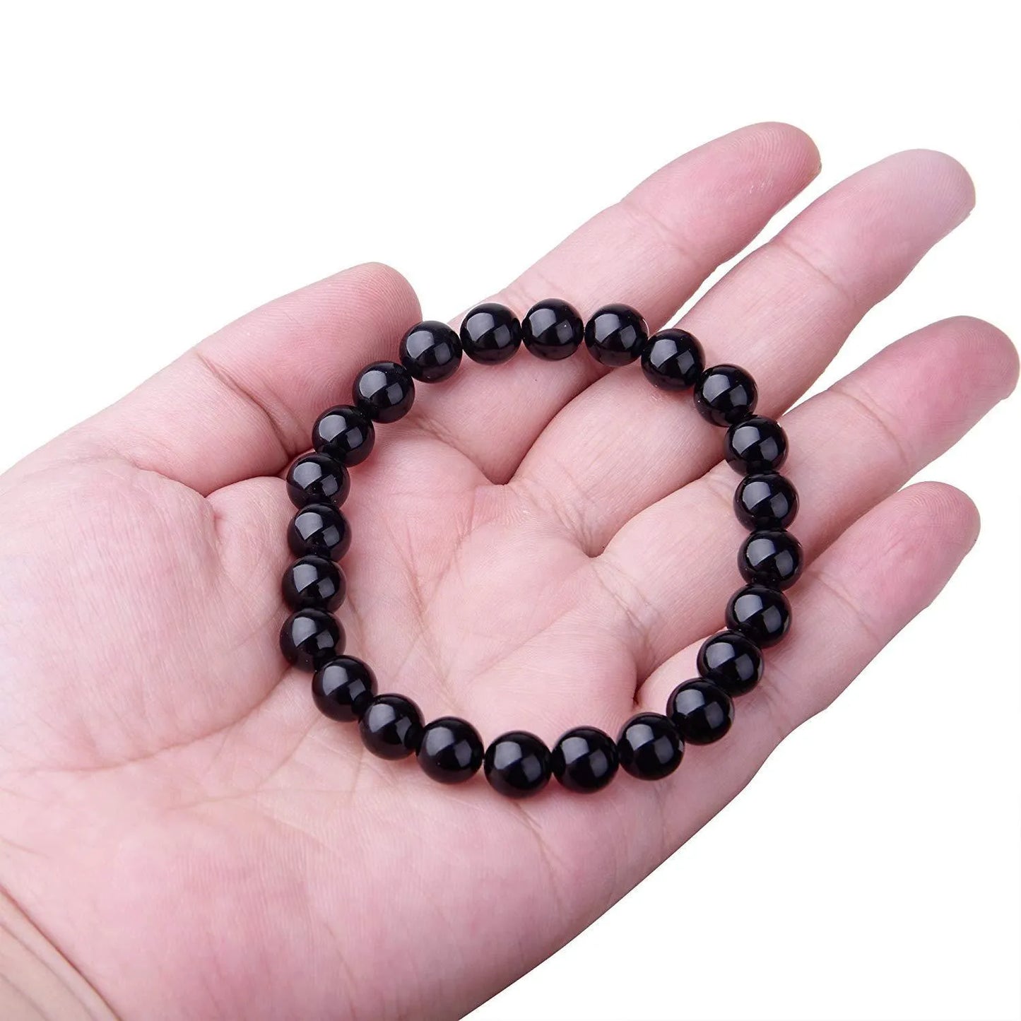 Geometric black agate bracelet for women with 8mm beads on a black elastic cord.