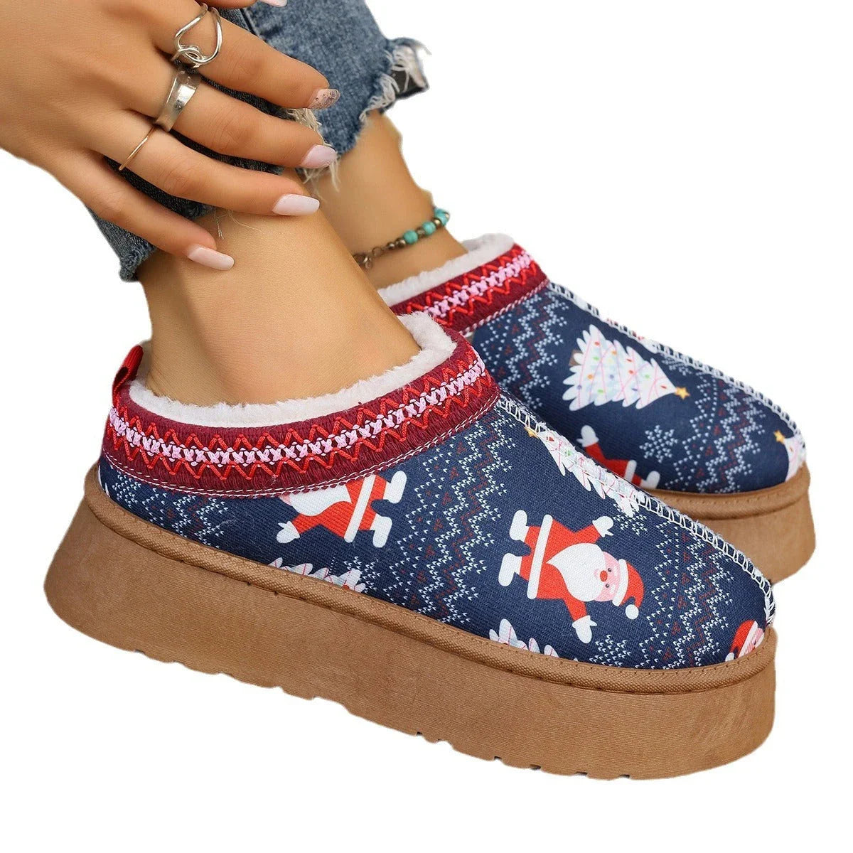 Women's winter ankle boots with festive cartoon Christmas print, plush lining, and durable EVA sole for comfortable, warm wear.