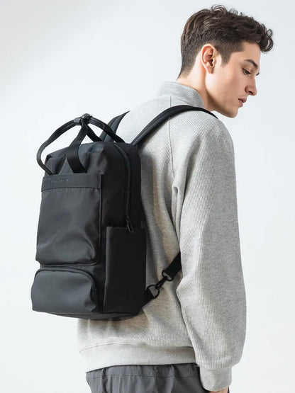 Elegant black Oxford cloth computer backpack with a 20-35 litre capacity.