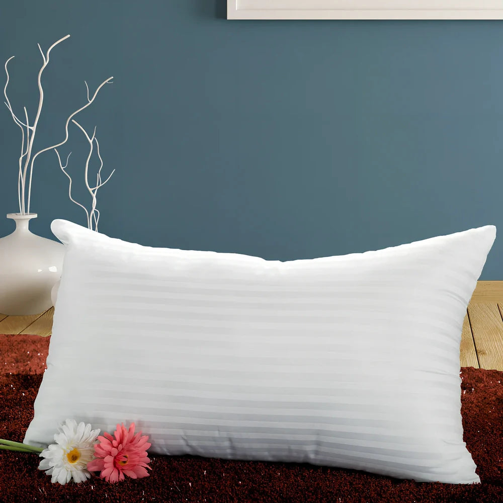 White square healthcare pillow measuring 40x70cm with polyester fibre filling