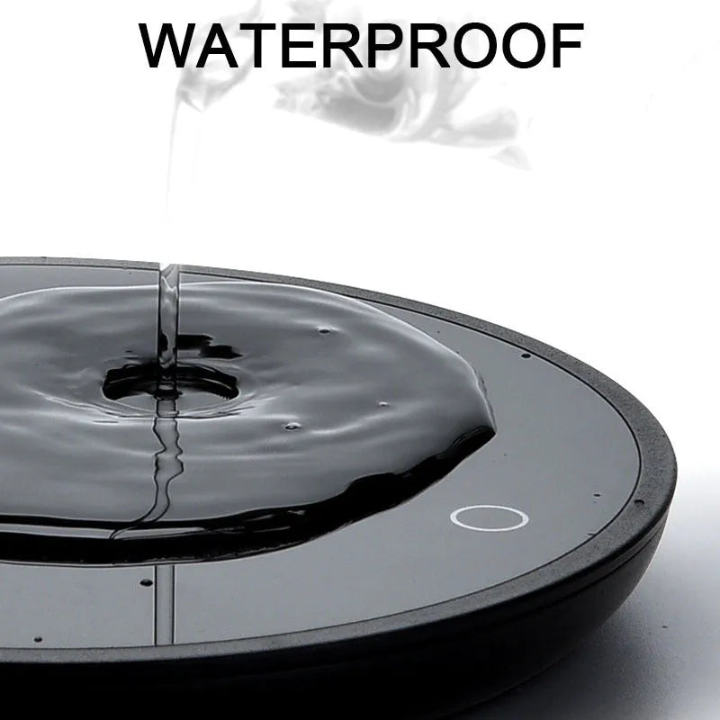 Black coffee mug warmer pad with temperature switch on desk