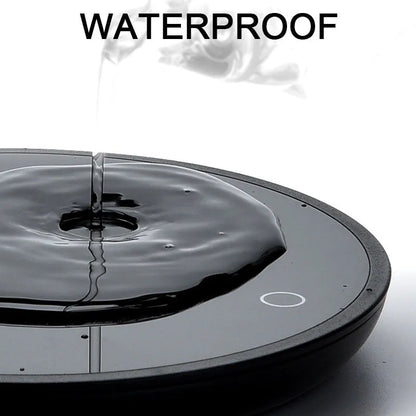 Black coffee mug warmer pad with temperature switch on desk