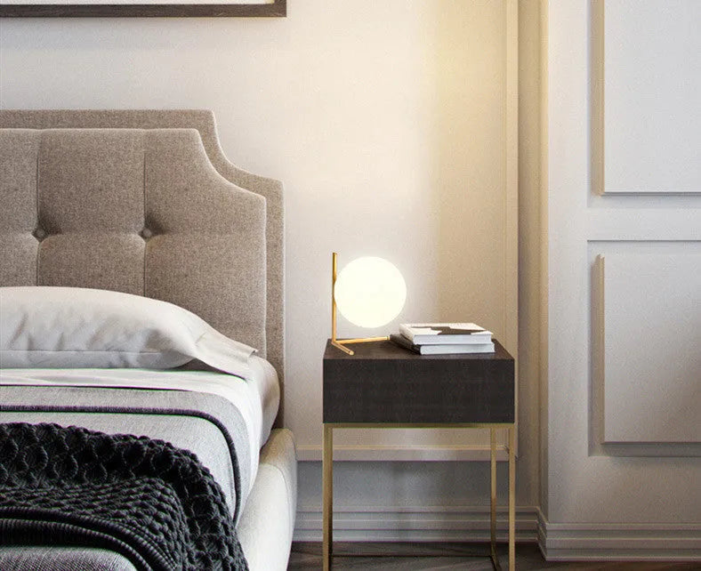 Creative glass table lamp with LED light in one of three available sizes for a living room or study