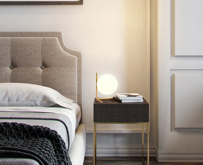 Creative glass table lamp with LED light in one of three available sizes for a living room or study