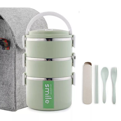 Stainless steel lunch box with built-in spoon, leak-proof design, available in green, pink, and blue