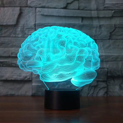 3D brain-shaped LED lamp with colour changing modes and remote control on wooden surface