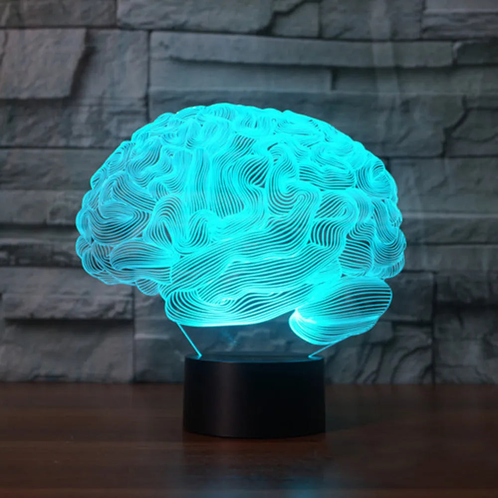 Brain-shaped 3D acrylic LED desk lamp on ABS base with remote control, showing colourful light projection.