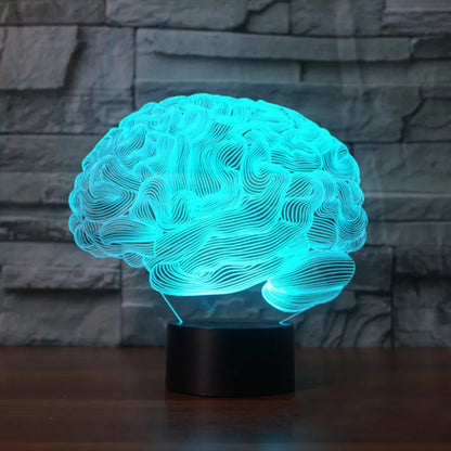 Brain-shaped 3D acrylic LED desk lamp on ABS base with remote control, showing colourful light projection.