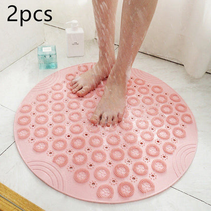 Textured round shower mat with anti-slip surface, massage nodules, and drainage holes for a comfortable and safe bathing experience